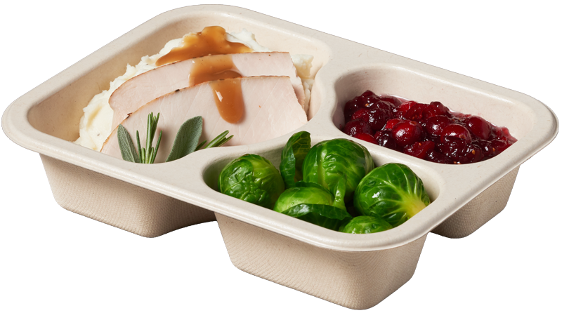 Compostable food tray with Hot Turkey Mashed Potatoes Gravy Cranberries Brussel Sprouts