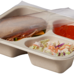 Compostable food tray with Turkey Sandwich Coleslaw Jello, with film peeled back