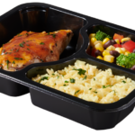 Plastic food tray with BBQ Chicken Veggies Rice