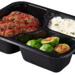 Plastic food tray with Meatloaf Mashed Potatoes Brussel Sprouts