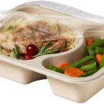 Compostable food tray with Chicken Rice Beans Carrots film peeled back