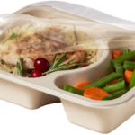 Compostable food tray with Chicken Rice Beans Carrots film peeled back