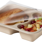 Compostable food tray with Roast Beef Sandwich Apple Salad film peeled back