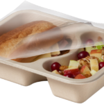 Compostable food tray with Roast Beef Sandwich Apple Salad film peeled back