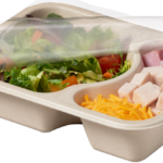 Compostable food tray with Salad Ham Cheese film peeled back