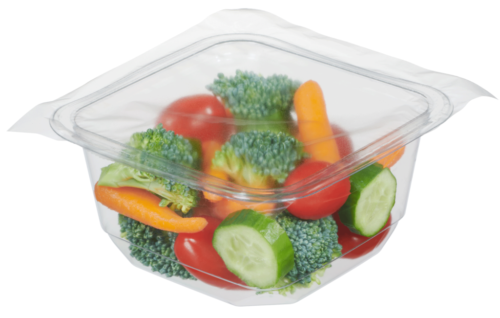 Sealed, single-compartment tray with broccoli, carrots, tomatoes and cucumbers.