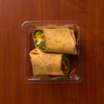 1 Compartment Plastic Cold Tray with Insert containing a Veggie Wrap top view
