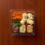 1 Compartment Plastic Cold Tray with Insert containing Veggies & 3 Hummus choices