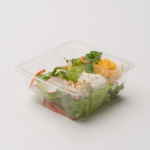 1 Compartment Plastic Cold Tray with Insert containing Salad, Turkey, Ranch & Cheese in ¾ side view