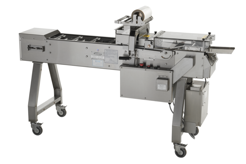 Automated food sealing machine for sealing student meals.