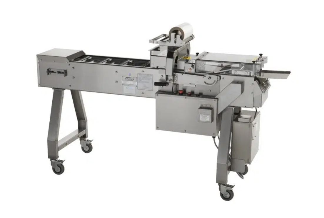 Image of the Speedseal MX-2 intermittent motion food tray packaging system, capable of high-volume output with adjustable speeds.